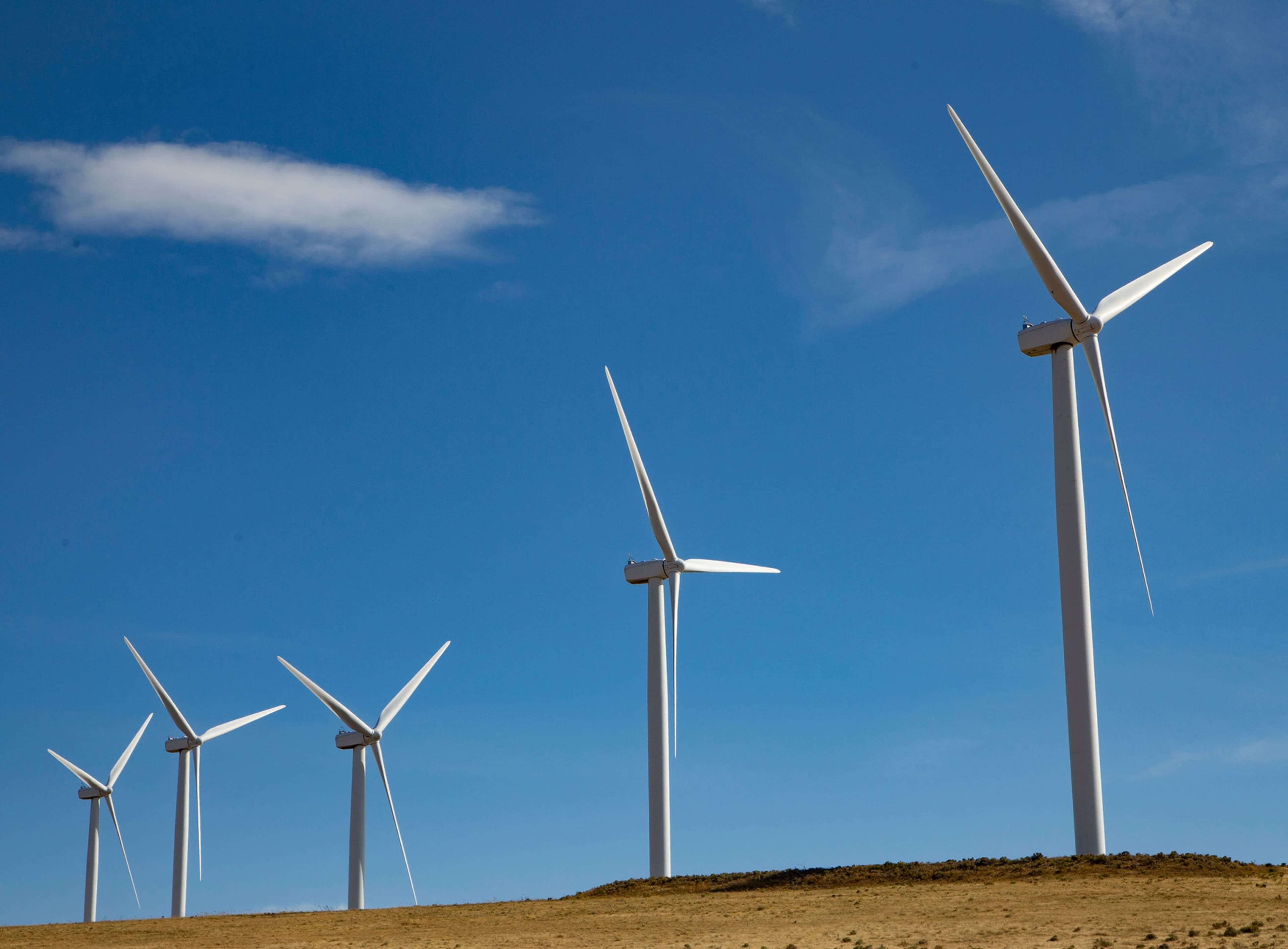 Wind turbines against a blue sky