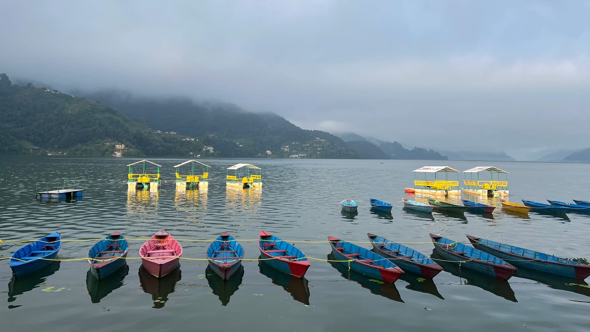 Small rowing boats moored in lake