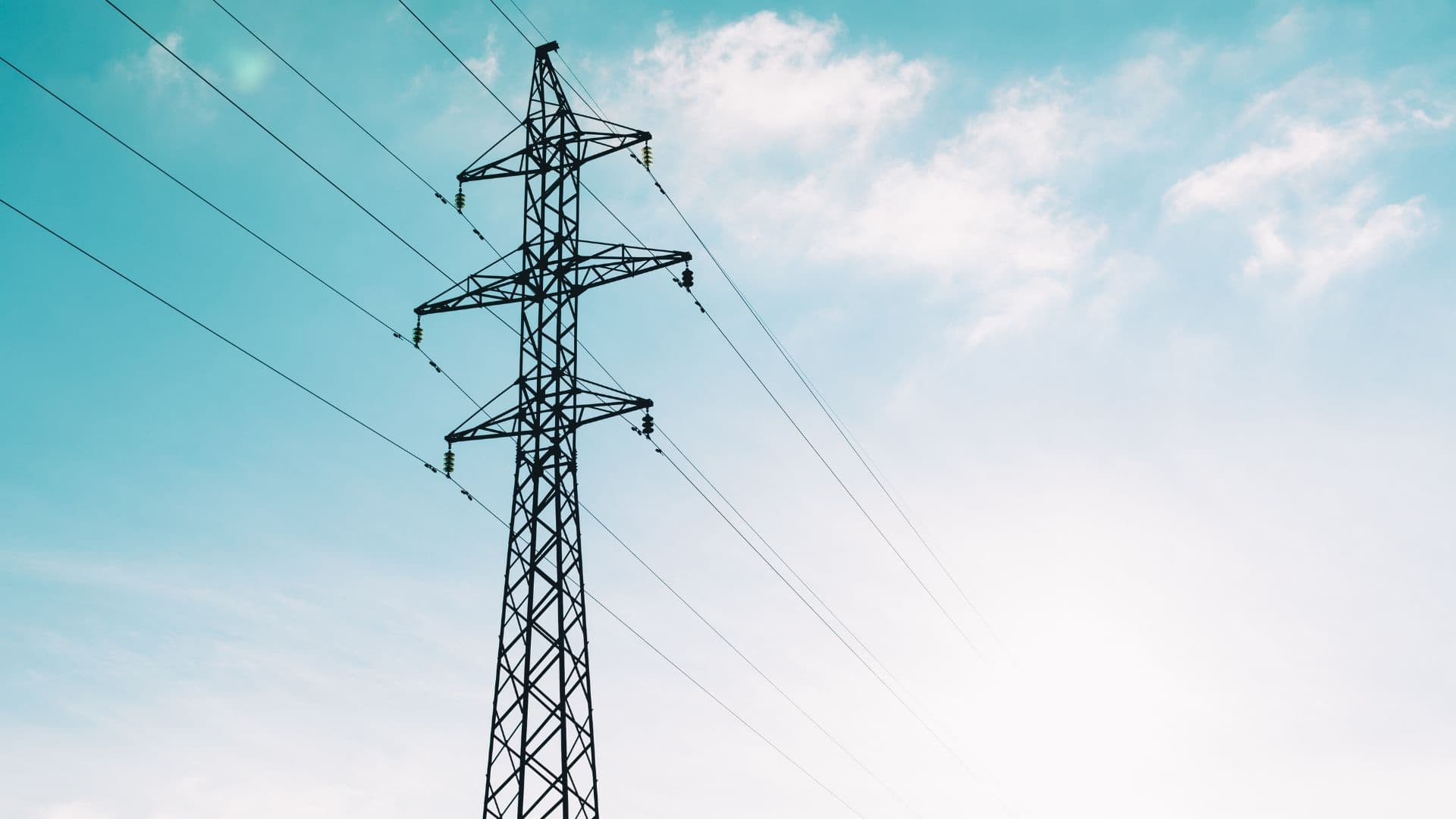 Transmission line against blue sky