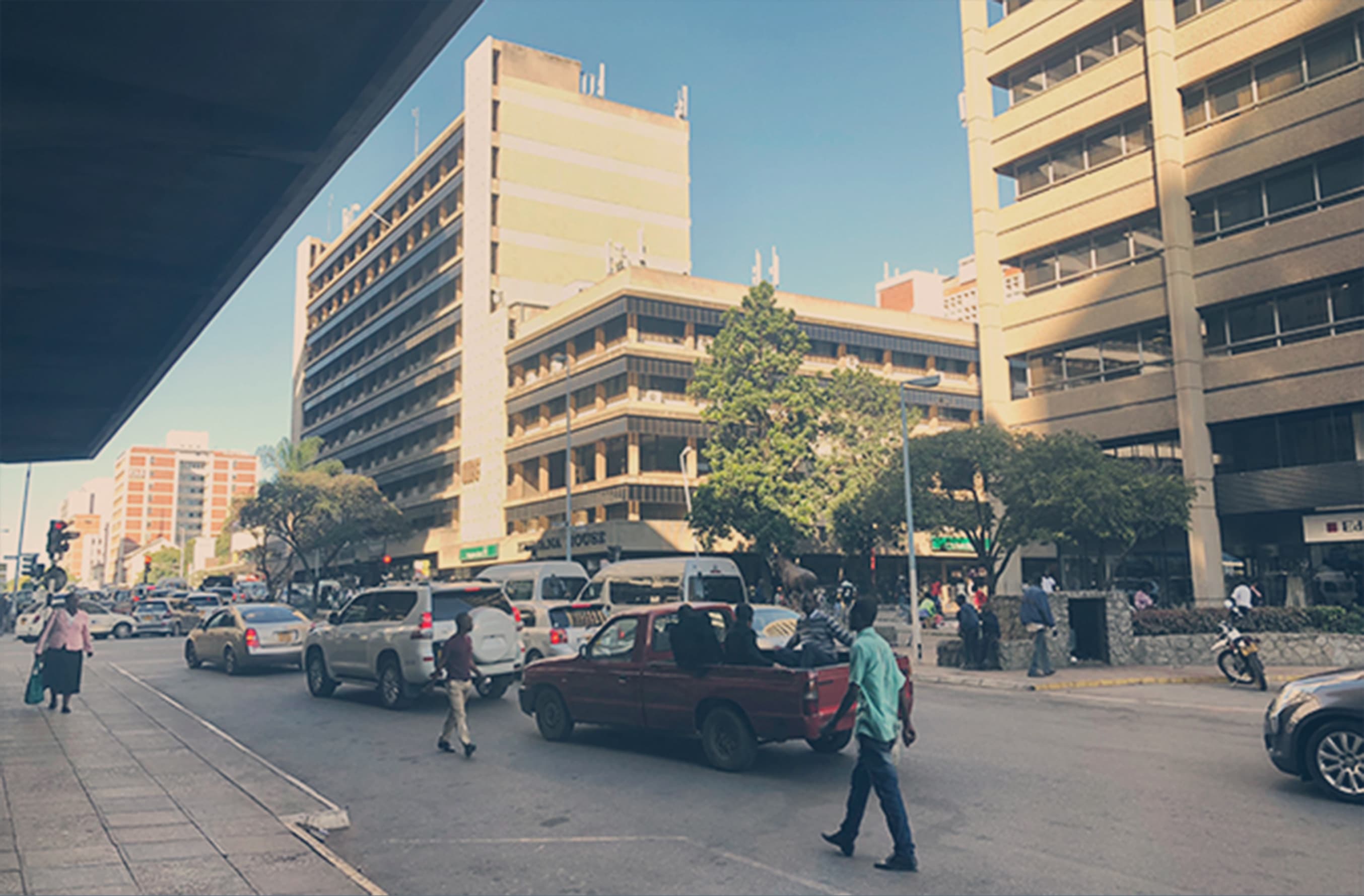 Street view with man walking in front of buildnings
