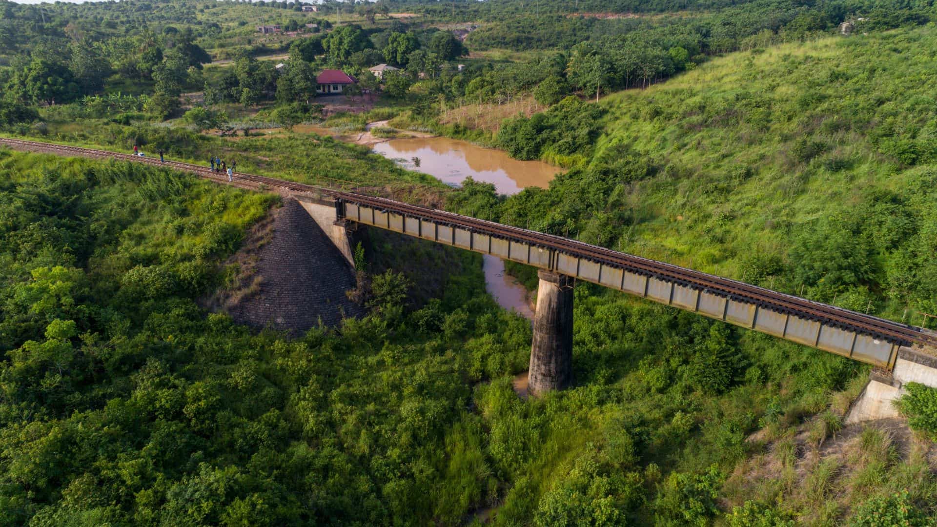 Railway bridge over green fields