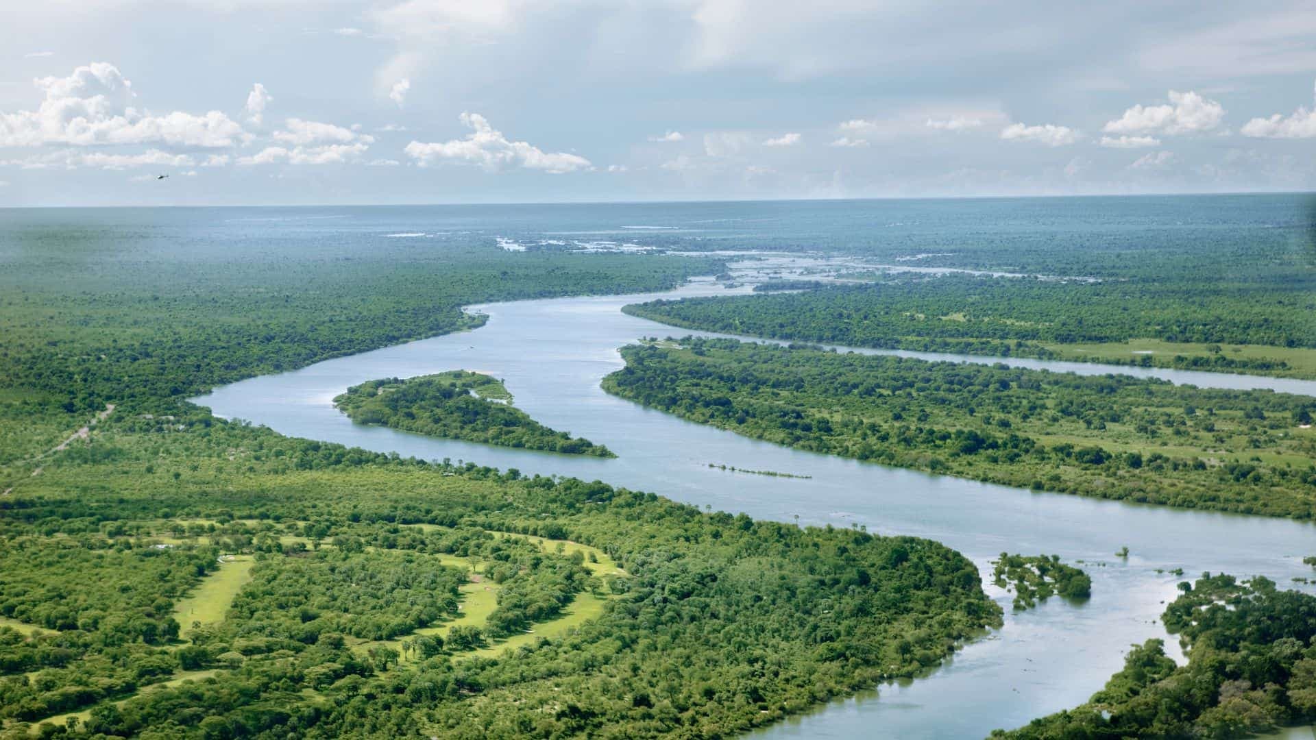 Meandering river in green landscape
