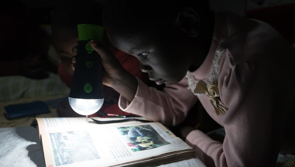 image of a girl holding a lamp